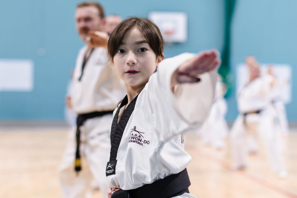 young student performing knife hand strike in Tae Kwon Do